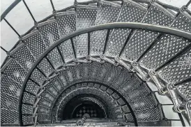  ?? Picture: ISTOCK ?? CAUGHT IN A SPIRAL: A staircase inside a lighthouse made entirely of steel