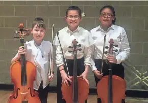  ?? JIM HIGGINS/MILWAUKEE JOURNAL SENTINEL ?? Cellists Simone Ribares (left), from St. Marcus Lutheran School; Adela Ramirez, from Milwaukee Parkside School for the Arts; and Joelle Askew, from Golda Meir School, shared the spotlight during a Progressio­ns concert at Milwaukee Youth Arts Center.