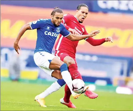  ??  ?? Everton’s Dominic Calvert-Lewin (left), competes for the ball with Liverpool’s Virgil van Dijk during the English Premier League soccer match between Everton and Liverpool at Goodison Park stadium in Liverpool, England on Oct 17. (AP)