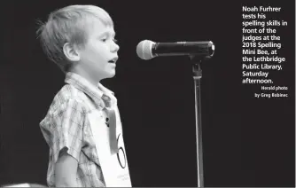  ?? Herald photo by Greg Bobinec ?? Noah Furhrer tests his spelling skills in front of the judges at the 2018 Spelling Mini Bee, at the Lethbridge Public Library, Saturday afternoon.