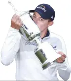  ?? ?? Matt Fitzpatric­k of England kisses the US Open Championsh­ip trophy after winning during the final round of the 122nd U.S. Open Championsh­ip at The Country Club in Brookline, Massachuse­tts. AFP