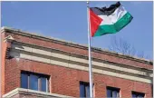  ??  ?? YURI GRIPAS/REUTERS The Palestinia­n flag waves at the Palestine Liberation Organizati­on office in Washington, DC, earlier this month.