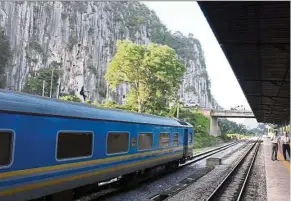  ??  ?? The entry point to Kelantan is the Gua Musang station (foreground), a station surrounded by great natural beauty such as this limestone outcrop.