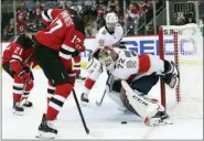  ?? MARY ALTAFFER — THE ASSOCIATED PRESS ?? Florida Panthers goaltender Sergei Bobrovsky (72) makes the save against New Jersey Devils right wing Wayne Simmonds (17) during the second period of an NHL hockey game, Monday in Newark, N.J.