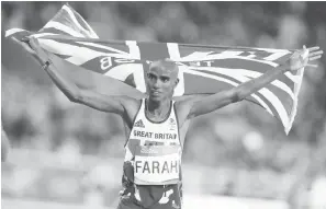  ?? The Associated Press ?? ■ Britain’s Mo Farah celebrates winning the gold medal in the men’s 10,000-meter final during the 2016 Summer Olympics on Aug. 13, 2016, in Rio de Janeiro, Brazil. Four-time Olympic champion Farah has disclosed he was brought into Britain illegally from Djibouti under the name of another child. The British athlete made the revelation in a BBC documentar­y.