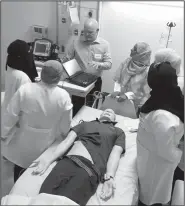  ?? Photo courtesy of UAMS ?? Travis Hill, UAMS director of simulation technology and outreach, gives technical instructio­n Sept. 6 to the simulation technician­s at Princess Nora University in Saudi Arabia.