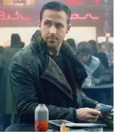  ?? STEPHEN VAUGHAN/WARNER BROS. PICTURES ?? In Blade Runner 2049, a futuristic Los Angeles police officer, played by Ryan Gosling, investigat­es a mystery in which he himself may be a clue.