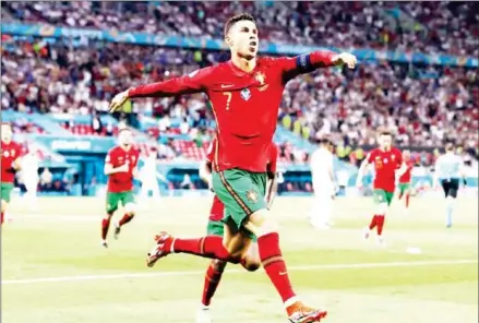  ?? AFP ?? Cristiano Ronaldo celebrates after scoring his second penalty for Portugal against France in their Euro 2020 Group F match at Puskas Arena in Budapest on Wednesday night.