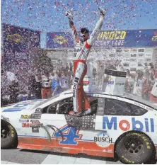  ?? AP PHOTO ?? GOING BACK TO CALI: Bakersfiel­d, Calif., native Kevin Harvick celebrates after winning the NASCAR Monster Energy auto race yesterday in nearby Sonoma, Calif.