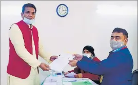  ?? HT FILE PHOTO ?? Sanjay Gupta, two-time BJP MLA from Laksar in Hardwar, files his nomination papers.