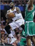  ?? AP PHOTO/TONY DEJAK ?? Cleveland Cavaliers' Kyrie Irving (2) goes up for a shot against Boston Celtics' Al Horford (42) during Game 4 of the NBA Eastern Conference finals, Tuesday in Cleveland.