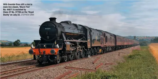  ?? STEPHEN GINN ?? With lineside fires still a risk to main line steam, ‘Black Five’ No. 44871 is assisted by Class 37 No. 37706 on the ‘Royal Duchy’ on July 22.