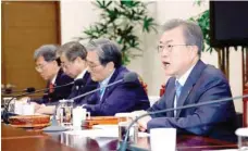  ?? — AFP ?? South Korean President Moon Jae-in (R) presides over a meeting of the National Security Council at the presidenti­al Blue House in Seoul on Monday.