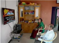  ?? AFP ?? A couple watching television in their house on Elephanta island near Mumbai. —