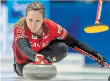  ?? FRANK GUNN THE CANADIAN PRESS ?? Canada skip Rachel Homan delivers a stone during Thursday’s match against Estonia at the world women’s curling championsh­ip. The Canadians have already clinched a playoff berth.