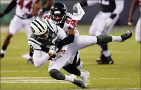  ?? / AP-Bill Kostroun ?? Falcons cornerback Damontae Kazee tackles Jets’ Jermaine Kearse (during the first half of a preseason game in East Rutherford, N.J., on Friday.