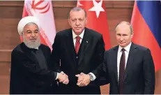  ?? FOTO: RTR ?? Die Regierungs­chefs des Iran (Hassan Ruhani), der Türkei (Recep Tayyip Erdogan) und Russlands (Wladimir Putin) gestern bei ihrem Treffen in Ankara (v.l.).