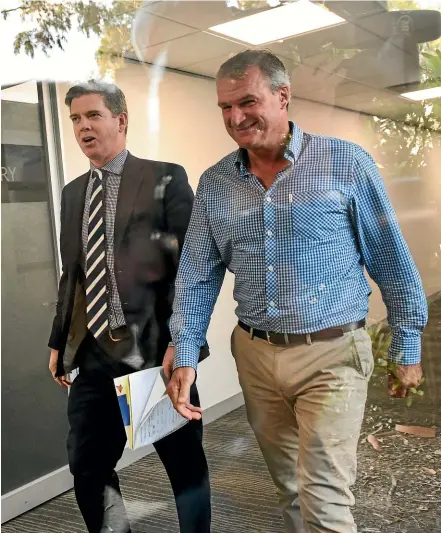  ?? GETTY IMAGES ?? Renowned trainer Darren Weir, right, puts on a brave face as he arrives at the Racing Victoria hearing yesterday where he was disqualifi­ed for four years.