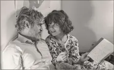  ?? Tobin Yelland / A24 Films via AP ?? Joaquin Phoenix, left, and Woody Norman in a scene from “C’mon C’mon.”