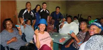  ??  ?? The women were into playing dominoes. Clockwise, from centre front: Johanna de Jager (with hat), Maggie Coetser, Monica Alkaster, Sina Boesak, Jolene de Bruyn, Cheweney Hendricks and Mercia Willemse. Back: Jearus Nicholson (municipal sports section), Ejustley Boshoff-Landers (coordinato­r: Gender and Disability) and coaches Buran Parks and Leono Oosthuizen.