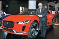  ??  ?? Ian Callum, Jaguar’s design director, presents his latest work at the ongoing Shanghai auto show: the concept I-PACE, the marque’s first pure electric model, which will hit the Chinese market in 2018.