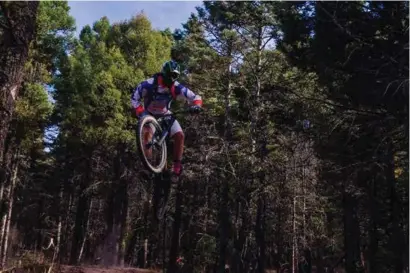  ?? COURTESY OF ANGEL FIRE BIKE PARK ?? A skilled rider catches some air on one of Angel Fire Bike Park’s mountain bike trails.