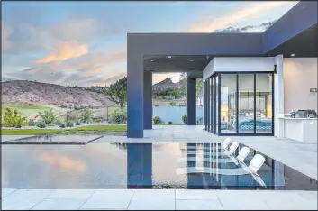  ?? JPM Studios ?? The Southern Highlands home has a resort-style pool and offers sweeping views of the desert mountains.