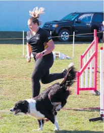  ??  ?? Erin Ball heads to the finish line with her border collie at the Levin competitio­n.