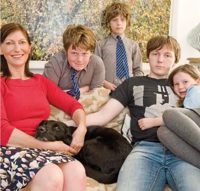  ??  ?? What price parenthood? Lucy Cavendish with her four children and Georgie the dog