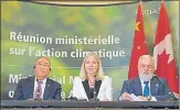  ?? AFP ?? Canadian environmen­t minister Catherine McKenna (centre) speaks to media after a meeting on implementi­ng Paris accord.