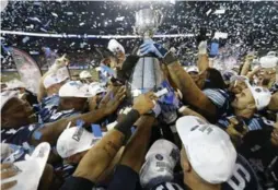  ?? MARK BLINCH/REUTERS ?? The Argos celebrate their win over the Calgary Stampeders in the 100th Grey Cup.