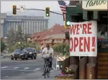  ?? JANE TYSKA — BAY AREA NEWS GROUP VIA AP ?? Traffic flows along Highway 50 near Stateline, Nev., as residents begin to return to South Lake Tahoe.