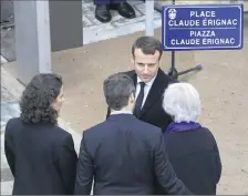  ??  ?? La famille Erignac et Emmanuel Macron ont inauguré, hier à Ajaccio, une place portant le nom de l’ancien préfet. (Photo AFP)