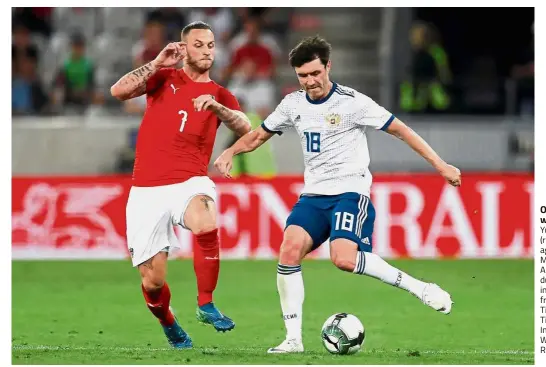  ??  ?? Out of my way:
Russia’s Yuri Zhirkov (right) in action against Austria’s Marko Arnautovic during an internatio­nal friendly at the Tivoli Stadion Tirol in Innsbruck on Wednesday. — Reuters