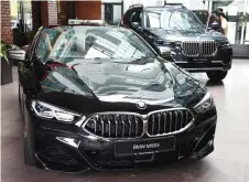  ??  ?? The BMW M850i and BMW X7 xDrive 40i.