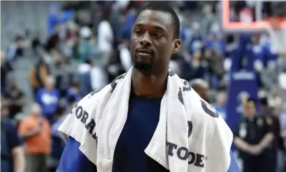  ??  ?? Harrison Barnes walks off the court after learning he is heading to Sacramento. Photograph: Tony Gutierrez/AP