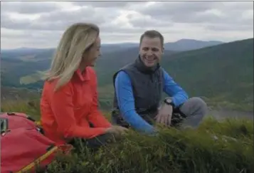  ??  ?? Actress Aoibhín Garrihy and her husband John Burke in the Wicklow uplands in ‘Tracks and Trails’.