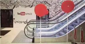  ?? BLOOMBERG PIC ?? A mural for YouTube Inc displayed at the entrance to Google Inc’s Kings Cross office in London. YouTube says it is doing more every day to tackle violent extremism.