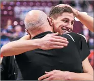  ?? MEDIANEWS GROUP FILE PHOTO ?? Collin Gillespie (right) gets a hug from Archbishop coach John Mosco (left) after defeating Meadville in the PIAA Class 5A boys’ basketball championsh­ip Friday, March 24 at the Giant Center in Hershey.