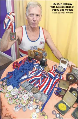  ?? Picture: Paul Amos FM4890644 ?? Stephen Holliday with his collection of trophy and medals