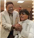  ??  ?? Fats Domino visits with Little Richard in a dressing room after Richards’ performanc­e at The Domino Effect, a tribute concert for Domino, at the New Orleans Arena in New Orleans. — AP photos