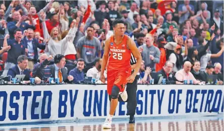  ?? THE ASSOCIATED PRESS ?? Syracuse guard Tyus Battle heads downcourt after making a 3-point basket during the closing minutes of an NCAA tournament second-round game against Michigan State on Sunday in Detroit. Syracuse beat Michigan State 55-53.