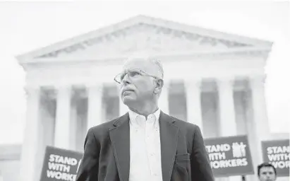  ?? ANDREW HARNIK/AP ?? Plaintiff Mark Janus stands outside the Supreme Court in June 2018 in Washington, D.C.