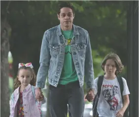 ?? UNIVERSAL STUDIOS ?? Alexis Rae Forlenza, left, Pete Davidson and Luke David Blumm star in The King of Staten Island, directed by Judd Apatow.