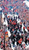  ?? [SARAH PHIPPS/ THE OKLAHOMAN] ?? Fans cheer as Oklahoma State football players walk to the stadium during the Spirit Walk before a game last season. OSU elected Wednesday to not allow tailgating this season due to the COVID-19 pandemic.