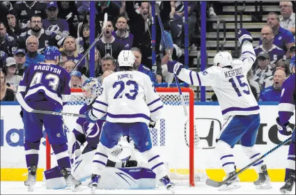  ?? Chris O’meara The Associated Press ?? Maple Leafs center Alexander Kerfoot (15) celebrates his overtime game-winner in Game 4 as Toronto rallied from a 4-1 deficit to beat Tampa Bay.