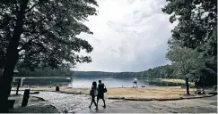  ?? CHARLES KRUPA/THE ASSOCIATED PRESS ?? Two centuries after Henry David Thoreau’s birth, people are still discoverin­g Walden Pond, the little lake he immortaliz­ed.