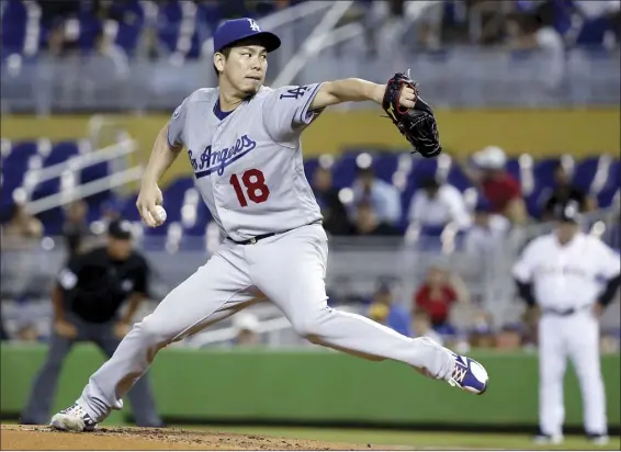  ?? AP photo ?? Los Angeles Dodgers’ Kenta Maeda delivers a pitch during the Dodgers’ 7-0 win against the Miami Marlins on Thursday. Maeda pitched eight innings and struck out eight batters.