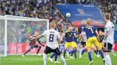  ??  ?? GETTY IMAGES Toni Kroos (No. 8) strikes Germany’s winner in the 2-1 victory over Sweden at the 2018 World Cup in Sochi‘s Fisht Stadium in Russia on June 23, 2018.