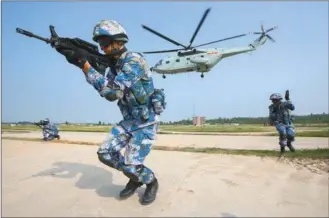  ?? XINHUA ?? Chinese and Russian marines participat­e in the Joint Sea 2016 drill that started on Tuesday and will last until Sept 19 off Guangdong province in the South China Sea.